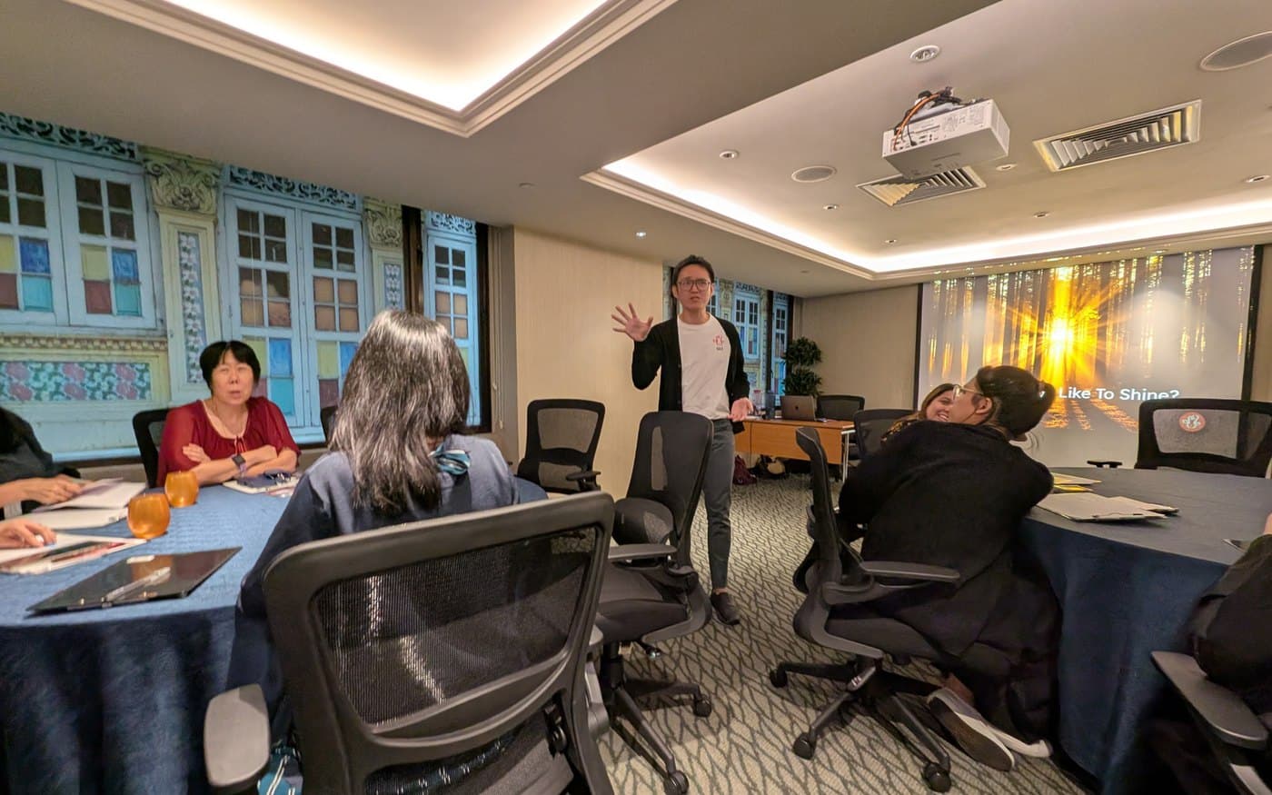 Eugene facilitating the Finding Balance Within workshop for the Royal Plaza on Scotts team